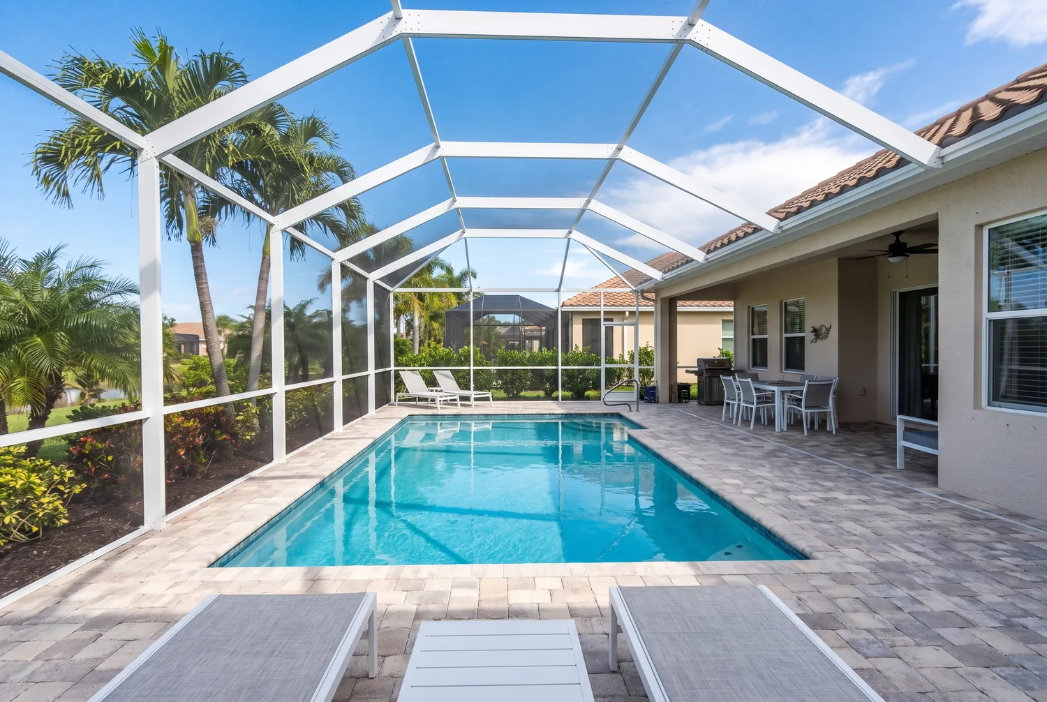 Freshly cleaned screened pool enclosure on a Jacksonville, FL home